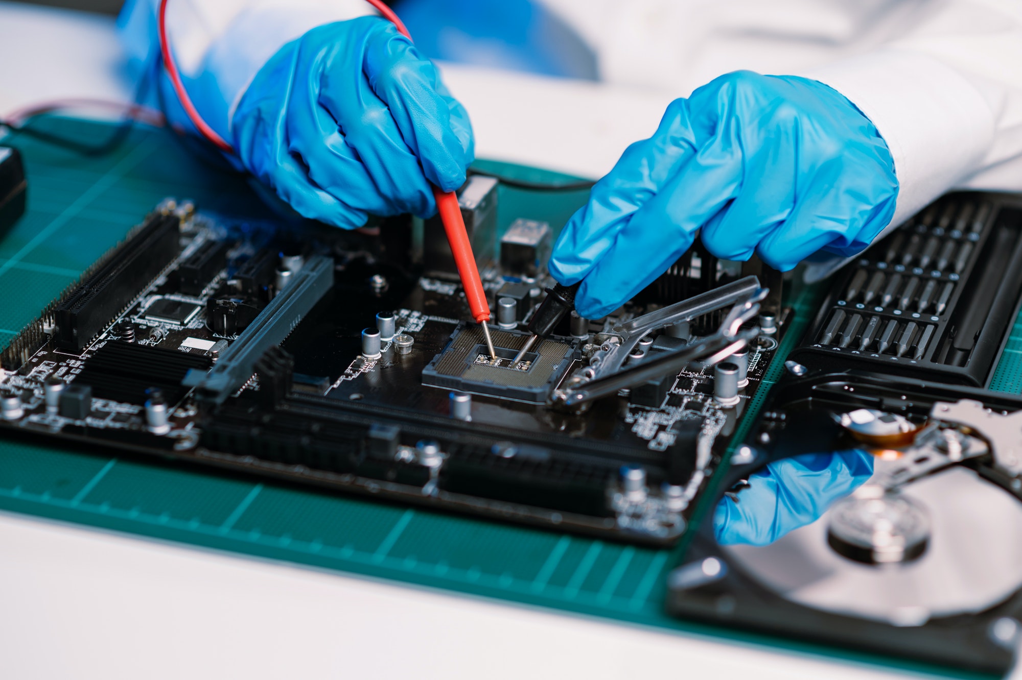 The technician repairing the motherboard in the lab with copy space.the concept of computer hardware